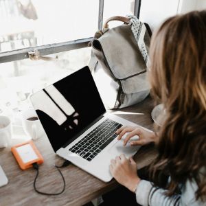 a woman working with a laptop
