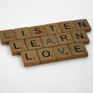 Letters from a game of scramble that read- listen, learn, and love.