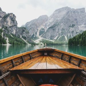 a boat traveling with a mountain view