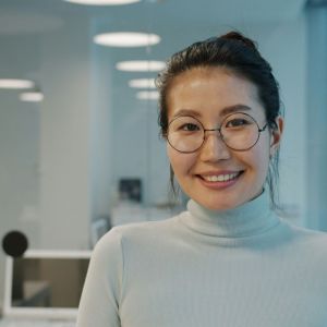 A young woman smiling.