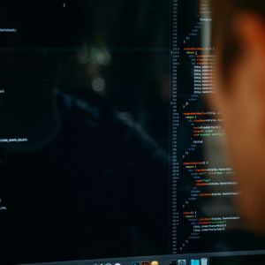 A man looking at the wrong section of a coded page.