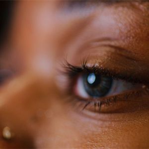 An African American woman in deep thought.