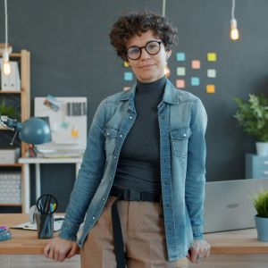 A teacher standing in her classroom.
