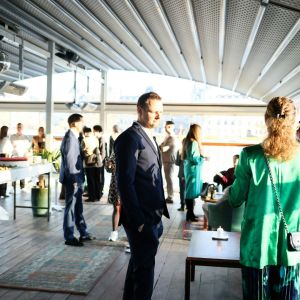 Professionals networking at a convention.