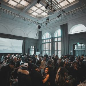 A room filled with people. Some of which are not paying attention.