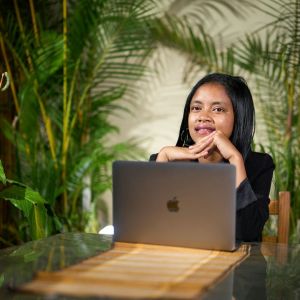 A woman at a laptop.